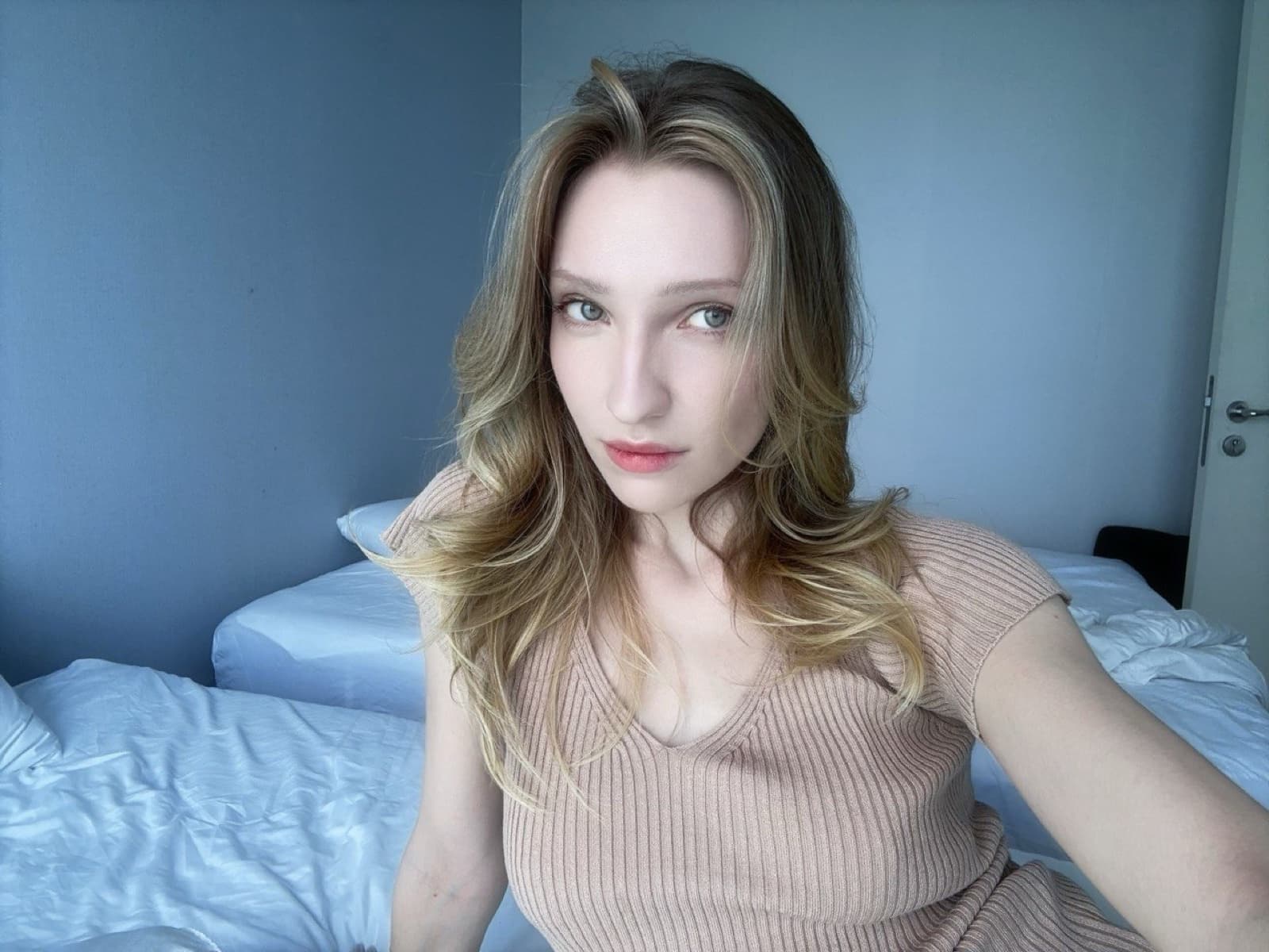 Stacey in a pale blue room